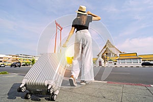 Bangkok`s tourist attractions in Thailand. With a suitcase