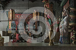 Architecture interior of Traditional chinese shrine and Chinese god statues on Chinese altar table