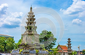 Bangkok, Thailand - April 17, 2019: In the enclosure of the Wat Pho, the temple of the Reclining Buddha on sky background.