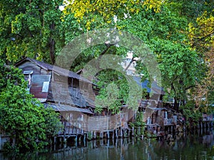 Bangkok, Thailand, April 4, 2019 : Old wooden houses in the riverside community