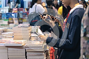 Bangkok, Thailand - April 6, 2019 : People choose books at Bangkok International Book Fair at Queen Sirikit National Convention