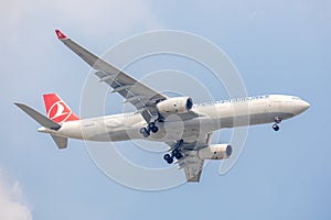 Plane or aircraft of Turkish Airlines or Airways on the sky landing to Suvanabhumi airport.