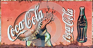 Grunge rusty retro vintage Coca-Cola advertising metal board sign