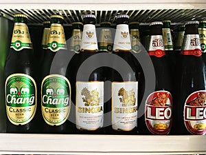 Thai beer bottles popular brands placed on shelf in refrigerator