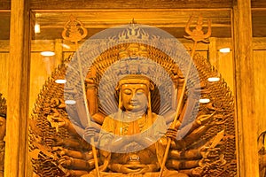 Bangkok, Thailand - December, 20, 2021 : Golden Wood Statue of Guan Yin with 1000 hands At Leng Noei Yi 2 or Mangkon Temple in