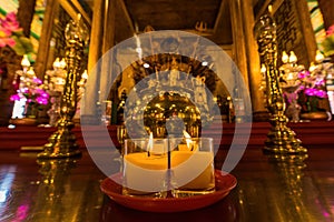 Bangkok, Thailand - December, 20, 2021 : Praying and meditation with burning candle on Chinese temple in Wat Leng Nei Yee 2 Temple