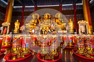 Bangkok, Thailand - December, 20, 2021 : Praying and meditation with burning candle on Chinese temple in Wat Leng Nei Yee 2 Temple