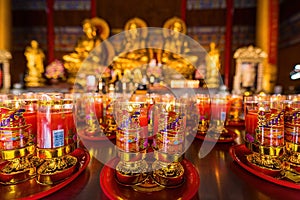 Bangkok, Thailand - December, 20, 2021 : Praying and meditation with burning candle on Chinese temple in Wat Leng Nei Yee 2 Temple