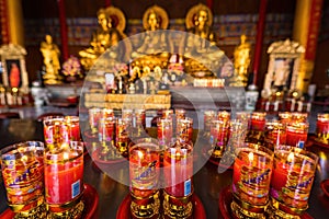 Bangkok, Thailand - December, 20, 2021 : Praying and meditation with burning candle on Chinese temple in Wat Leng Nei Yee 2 Temple
