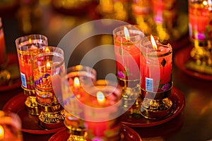 Bangkok, Thailand - December, 20, 2021 : Praying and meditation with burning candle on Chinese temple in Wat Leng Nei Yee 2 Temple