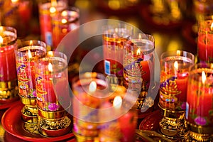 Bangkok, Thailand - December, 20, 2021 : Praying and meditation with burning candle on Chinese temple in Wat Leng Nei Yee 2 Temple