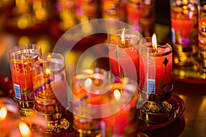 Bangkok, Thailand - December, 20, 2021 : Praying and meditation with burning candle on Chinese temple in Wat Leng Nei Yee 2 Temple