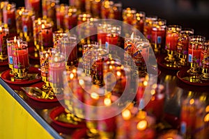 Bangkok, Thailand - December, 20, 2021 : Praying and meditation with burning candle on Chinese temple in Wat Leng Nei Yee 2 Temple