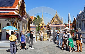 Bangkok, Thailand - December 02, 2019: Tourists visiting the Wat Phra Kaew, Temple of the Emerald Buddha, and Grand Palace complex