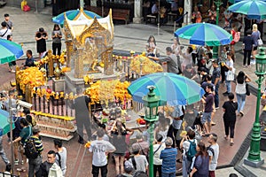 Bangkok, Thailand - December 16, 2020 : unidentified tourists and thai people praying respect the famous Erawan shrine at