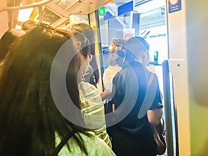 Bangkok, Thailand - February 28, 2017: Crowd of passengers on BTS Skytrain arrived BTS Siam Station and exit the train to