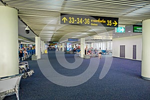 BANGKOK, THAILAND - FEBRUARY 08, 2018: Indoor view of unidentified people waiting inside of the airport at Suvanaphumi