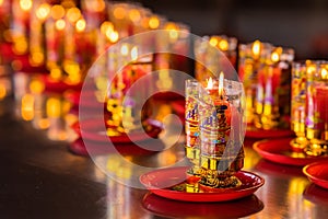 Bangkok, Thailand - January, 26, 2022 : Praying and meditation with burning candle on Chinese temple in Wat Leng Nei Yee 2 Temple