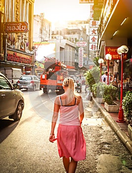 BANGKOK, Thailand - July 31: The China Town at Yaowarat Road. Young woman walking down the street, Thailand on July 31, 2010.