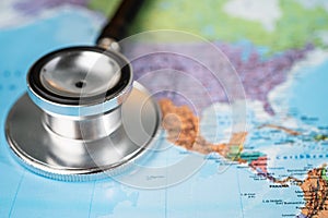 Bangkok, Thailand - June 1, 2020 : Stethoscope on USA America world globe map.