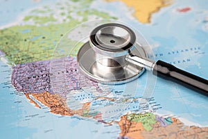 Bangkok, Thailand - June 1, 2020, Stethoscope on USA America world globe map background