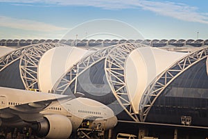 Bangkok, Thailand - June 13, 2017: Terminal building with the airplanes at Suvarnabhumi international airport, Bangkok, Thailand