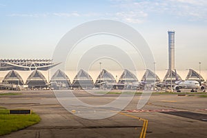 Bangkok, Thailand - June 13, 2017: Terminal building with the airplanes at Suvarnabhumi international airport, Bangkok, Thailand