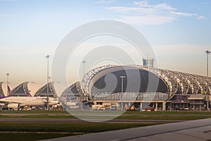 Bangkok, Thailand - June 13, 2017: Terminal building with the airplanes at Suvarnabhumi international airport, Bangkok, Thailand