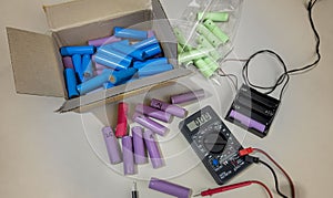 BANGKOK, THAILAND - March 12, 2023: Used Recycled Lithium Ion 18650 Battery Cells being Tested