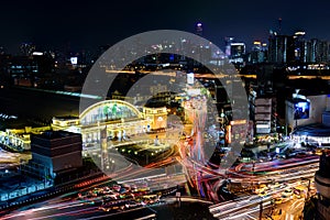 Bangkok,Thailand March 23,2019 : Night Cityscape of bangkok with top view of Hua Lamphong Railway station and and the traffic jam.