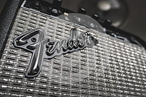 A Fender guitar brand logo on guitar amplifier.