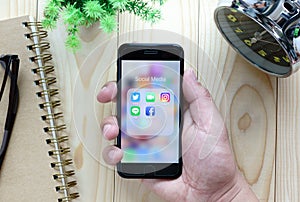 Hands using Iphone7 with application icons