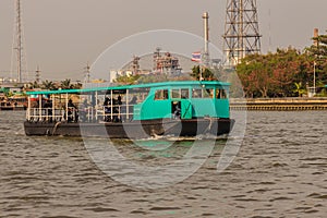 Bangkok, Thailand - March 14, 2017: People are crossing Chao Phraya river from Wat Bang Nam Pheung Nok via ferry service to Wat B