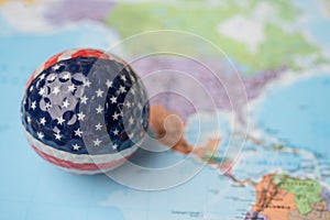 Bangkok, Thailand, May 1, 2021 USA America map at golf ball with flag on world globe map