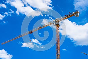 Bangkok, Thailand - May, 22, 2021 :Building crane and building under construction against cloudy sky at Bangkok, Thailand