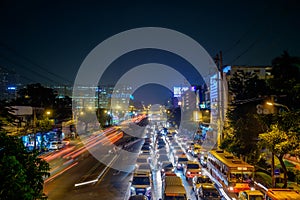 Traffic jam moves slowly along a busy road in city center in Bangkok. Annually an estimated 150,000 new cars join the heavily