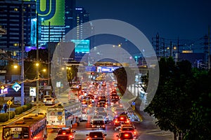 Traffic jam moves slowly along a busy road in city center in Bangkok. Annually an estimated 150,000 new cars join the heavily