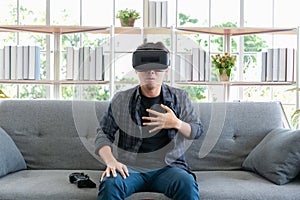 BANGKOK, THAILAND-October 24 :Asian man is wearing 3D virtual reality headset and is scared of something