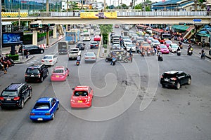 Traffic moves slowly along a busy road in Bangkok, Thailand