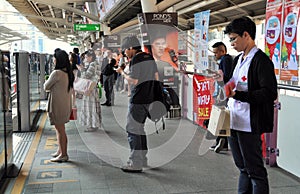 Bangkok, Thailand: Passengers at Sala Daeng BTS Station