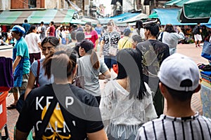 Crowd of people walking in market