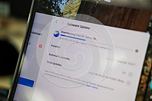 Bangkok ,Thailand - September 18, 2025 : Installing Software update MacOS 26 Tahoe system on MacBook