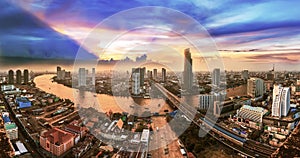 Bangkok Transportation at Dusk with Modern Business Building along the Chaopraya river (Thailand)