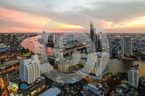 Bangkok Transportation at Dusk with Modern Business Building along the river (Thailand)