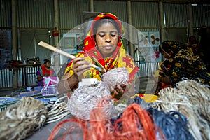 Handicraft maker women are making on a showpiece bird nests using on pineapple fiber at Madhupur,