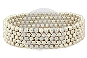 Bangle from silvery beads lies on white