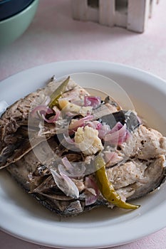 Bangus paksiw is a Filipino dish that uses milkfish in vinegar and spices
