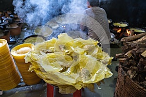 Banh xeo, Vietnamese traditional street food yellow crispy rice flour cake. Sizzling cake, named for the loud sizzling sound it