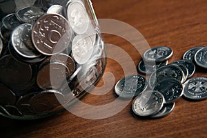 Bank with coins and a bunch of Russian rubles coins