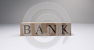 Bank word on wooden cubes in white background.